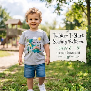 May include: A gray short-sleeve t-shirt featuring a colorful dinosaur graphic with the text Dino Adventure, a yellow sun, and trees. A white sign displays the text Toddler T-Shirt Sewing Pattern - Sizes 2T - 5T (Instant Download).