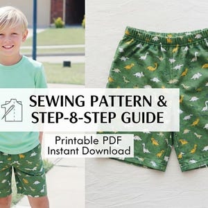 May include: Green shorts with a dinosaur pattern. The shorts are part of a sewing pattern and guide, available as a printable PDF for instant download. The shorts are worn by a young person wearing a green t-shirt.