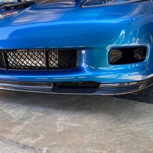 May include: A set of three ceramic mugs with a speckled, matte finish. The mugs are in shades of cream, light gray, and dark gray. Each mug has a simple, minimalist design and a rounded handle. Perfect for coffee or tea.