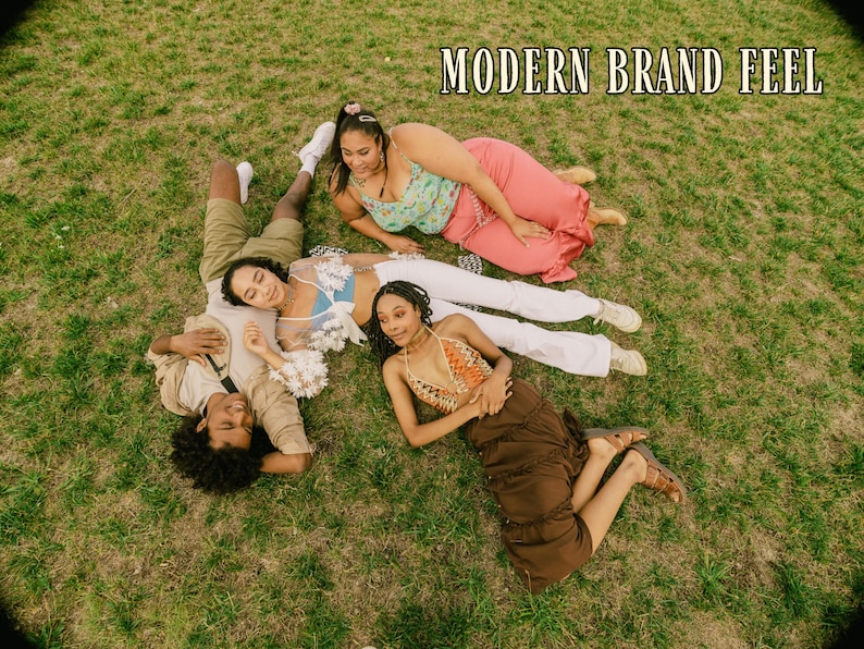 May include: An overhead shot of four people lying on green grass. They are wearing various outfits, including a crochet top, a floral top, and a brown skirt. The text "MODERN BRAND FEEL" is at the top of the image.
