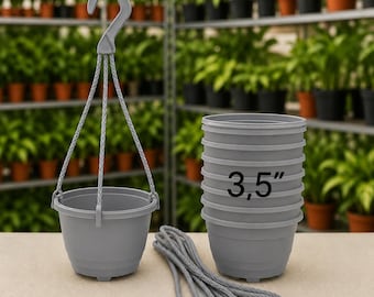 May include: A set of grey plastic hanging planters, each featuring a 3.5 inch diameter. The set includes one assembled planter with a hook and braided cord, a stack of identical empty planters, and an additional length of grey braided cord.