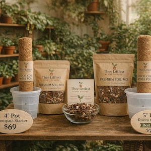 May include: A display of gardening supplies, including coco coir moss poles, soil mix, and starter pots. The items are arranged on a wooden table with a backdrop of lush greenery, creating a natural and inviting scene.