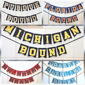 May include: A collage of decorative banners with the words "PURDUE BOUND", "FLORIDA BOUND", "MICHIGAN BOUND", "OKLAHOMA BOUND", and "COASTAL CAROLINA BOUND". Each banner features a different color scheme, with the letters in a contrasting color.