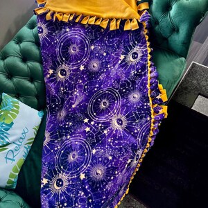 Celestial Zodiac Fleece Tie Blanket Wrap yourself (or a loved one) in comfort with this handmade, no-sew fleece tie blanket!
