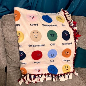 Emoji/Emotions Fleece Tie Blanket Wrap yourself (or a loved one) in comfort with this handmade, no-sew fleece tie blanket!