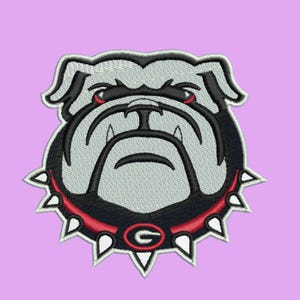 May include: Embroidered patch featuring a bulldog head with a gray face, black accents, and red eyes. The bulldog wears a black collar with white spikes and a red trim. The letter "G" is in the center of the collar.