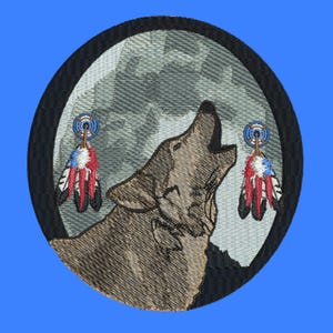 May include: Embroidered patch depicting a howling wolf against a moonlit backdrop. The wolf is brown, with detailed stitching. Two decorative feather pendants flank the wolf. The patch has a black border and is set against a blue background.
