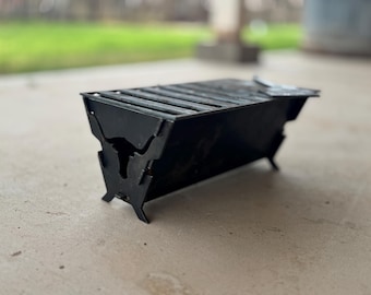Parrilla portátil plegable para acampar: fogata para cocinar al aire libre de acero cortado con plasma CNC
