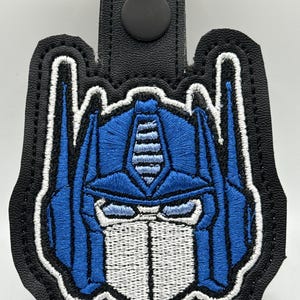 Optimus Prime Bag Tag | 80s Cartoon Zipper Pull | Geeky Backpack Charm | Handmade Zipper Tag | Retro Transformers Gift for Him or Her