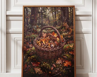 May include: A rectangular framed wall art print depicting a woven wicker basket filled with various brown and yellow mushrooms and acorns, resting on a forest floor covered in fallen autumn leaves, with a small squirrel visible in the background.
