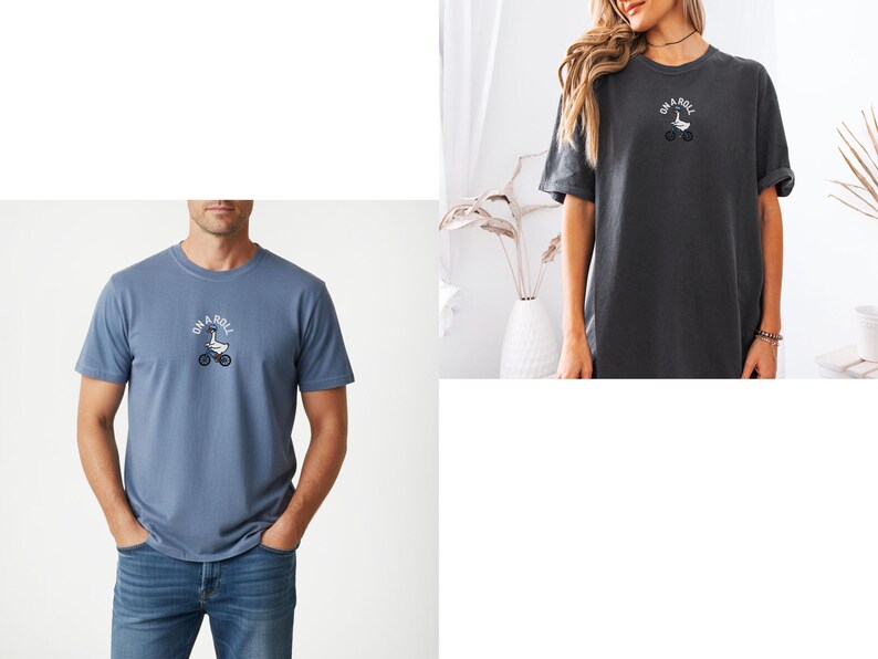 May include: A blue t-shirt and a charcoal gray t-shirt, each featuring a small graphic on the chest of a white goose riding a bicycle with the text "ON A ROLL" arched above the goose in a circular white font.