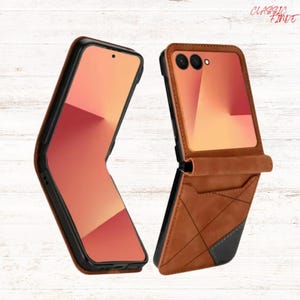May include: Two brown and black phone cases, one open and one closed, with a wallet-style design. The open case reveals a phone screen with a peach-coloured display. The cases have a geometric pattern and the text "CLASSIC FINDE".