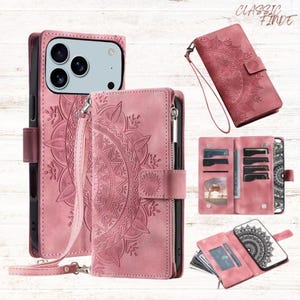 May include: Pink leather phone cases with a mandala design. The cases include a wallet style with card slots, a wrist strap, and a zipper closure. The phone cases are shown in various open and closed positions.