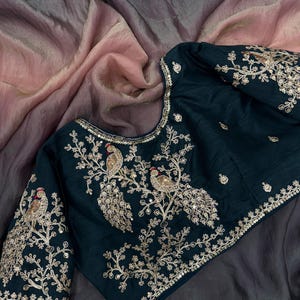 exclusive saree  with designer stitched blouse