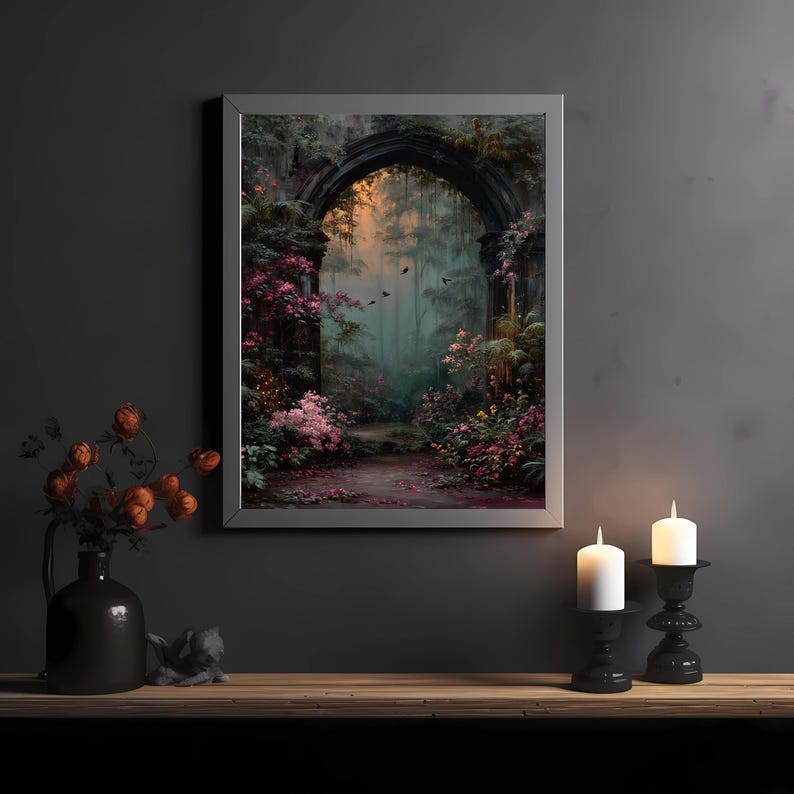 May include: A framed art print depicts a mystical forest scene with an arched stone entrance. The artwork features a path leading into a lush, colorful forest with pink and green foliage. Two white candles in black holders sit on a wooden surface.
