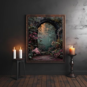 May include: A framed artwork depicts a mystical archway leading into a lush, overgrown garden. The painting features vibrant pink flowers, green foliage, and a path. Two white candles on a small table and a lit orange candle on a stand flank the artwork.