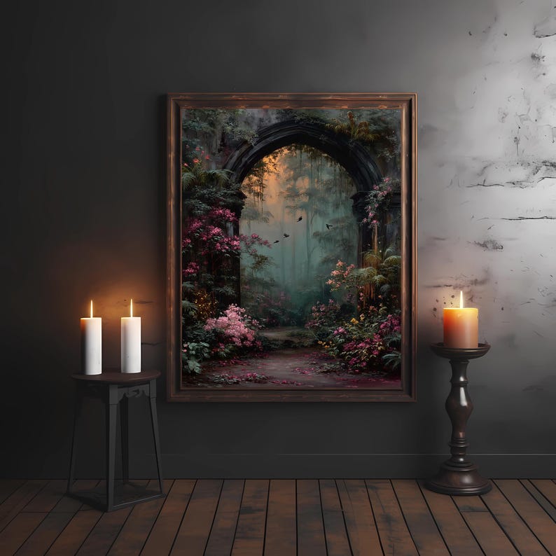May include: A framed artwork depicts a mystical archway leading into a lush, overgrown garden. The painting features vibrant pink flowers, green foliage, and a path. Two white candles on a small table and a lit orange candle on a stand flank the artwork.