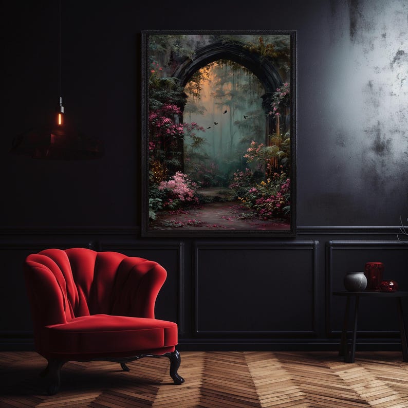 May include: A framed artwork depicts a mystical forest scene with an arched entrance. The painting features a path leading into a lush, green forest with pink and yellow flowers. A red velvet armchair sits in front of a black wall.