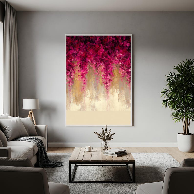 May include: Abstract art print featuring a vibrant display of magenta and gold brushstrokes, creating a cascading floral effect. The artwork is framed in a white border, with a cream-colored base. This piece is a decorative wall art.