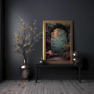May include: A framed landscape painting with a gold frame depicts a path leading into a forest. A black table holds the painting, two decorative glass spheres, and a small vase. A large silver vase holds a flowering branch.
