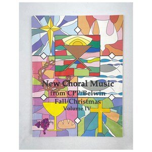 May include: A colorful book cover with the title "New Choral Music" and the subtitle "Fall/Christmas Volume IV." The cover features stained-glass style illustrations of a star, manger, chalice, cross, and grapes.