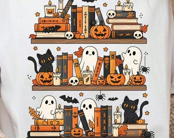 May include: A white t-shirt featuring a whimsical Halloween-themed design. The graphic depicts three shelves of books, pumpkins, candles, ghosts, bats, spiders, and black cats, creating a spooky and festive atmosphere.
