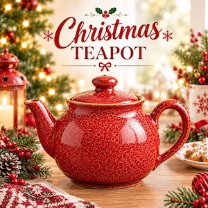 May include: A red ceramic teapot with a textured, speckled finish and a matching lid. The text "Christmas TEAPOT" is displayed above the teapot in a decorative font, accompanied by holly, snowflake, and bow graphic elements.