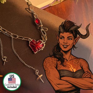 May include: A silver-toned necklace with a red heart pendant and a matching red gemstone. The necklace has a chain design with dangling cross charms. The image also features a cartoon illustration of a woman with horns and pointed ears.