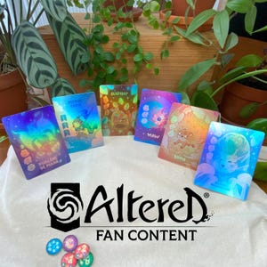 May include: Holographic fantasy trading cards with diverse character designs, arranged on a white cloth. The image includes the "Altered Fan Content" logo and several colourful game tokens, with lush green plants in the background.
