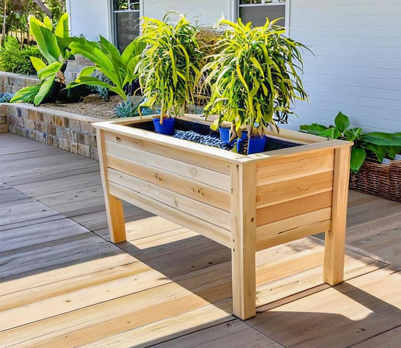 Step-by-step DIY raised planter box woodworking plans: build a sturdy, beautiful cedar garden bed (H 39.5" W 61", D 29") for patio, balcony, or backyard. Includes easy-to-follow PDF guide with detailed drawings, cut list, materials list (3x 2x4x8', 9x 1x6x6' cedar), and color-coded assembly instructions—perfect for growing vegetables, herbs, or flowers. Beginner-friendly, cost-effective, and designed to save 50% vs. store-bought planters. Instant download after purchase.