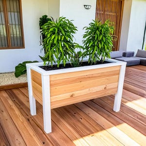 Step-by-step DIY raised planter box woodworking plans: build a sturdy, beautiful cedar garden bed (H 39.5" W 61", D 29") for patio, balcony, or backyard. Includes easy-to-follow PDF guide with detailed drawings, cut list, materials list (3x 2x4x8', 9x 1x6x6' cedar), and color-coded assembly instructions—perfect for growing vegetables, herbs, or flowers. Beginner-friendly, cost-effective, and designed to save 50% vs. store-bought planters. Instant download after purchase.