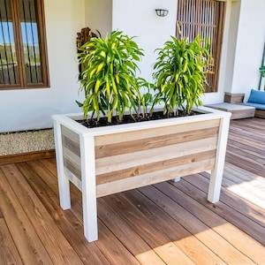Step-by-step DIY raised planter box woodworking plans: build a sturdy, beautiful cedar garden bed (H 39.5" W 61", D 29") for patio, balcony, or backyard. Includes easy-to-follow PDF guide with detailed drawings, cut list, materials list (3x 2x4x8', 9x 1x6x6' cedar), and color-coded assembly instructions—perfect for growing vegetables, herbs, or flowers. Beginner-friendly, cost-effective, and designed to save 50% vs. store-bought planters. Instant download after purchase.