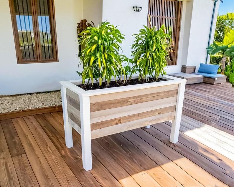 Step-by-step DIY raised planter box woodworking plans: build a sturdy, beautiful cedar garden bed (H 39.5" W 61", D 29") for patio, balcony, or backyard. Includes easy-to-follow PDF guide with detailed drawings, cut list, materials list (3x 2x4x8', 9x 1x6x6' cedar), and color-coded assembly instructions—perfect for growing vegetables, herbs, or flowers. Beginner-friendly, cost-effective, and designed to save 50% vs. store-bought planters. Instant download after purchase.