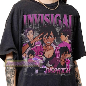 May include: A black short-sleeve t-shirt featuring a graphic print of an anime-style character in multiple poses with purple accents. The text INVISIGAI is printed in a large purple font at the top, and the word DISPATCH is printed in purple at the bottom.