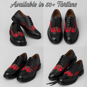 May include: Black leather Oxford shoes with red and yellow plaid accents. The shoes have a classic wingtip design with decorative perforations. The image includes the text "Available in 50+ Tartans".