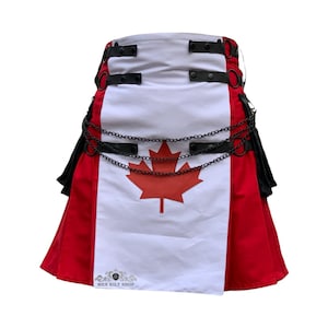 Op de afbeelding: Een kilt met het ontwerp van de Canadese vlag. De kilt heeft een wit middenpaneel met een rode esdoorn, rode zijpanelen, zwarte banden, metalen ringen en een kettingdetail.