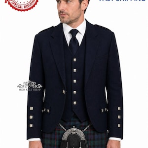 May include: A navy blue kilt jacket with matching vest and kilt. The jacket has silver square buttons and accents on the sleeves. A black sporran hangs from a chain. The kilt is a green, blue, and black plaid.
