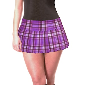 May include: A purple plaid mini skirt with a pleated design.