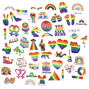 Könnte beinhalten: Eine Sammlung bunter Aufkleber mit Regenbogen- und LGBTQ+-Pride-Themen. Designs umfassen Herzen, Regenbogen, Katzen und Texte wie "Love Wins", "All Love is Equal" und "You Are Safe Here."