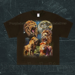 May include: Brown t-shirt featuring a graphic of four lions with open mouths, set against a night sky with a full moon. The lions are depicted in shades of brown and gold, with detailed manes and expressions.
