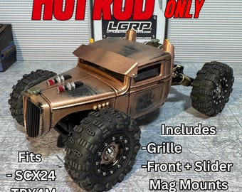 May include: A copper-colored Hot Rod cab with large black tires. The model includes a grille, front slider, mag mounts, and magnets. The text on the image says "HOT ROD CAB ONLY" and "Fits - SCX24 - TRX4M".