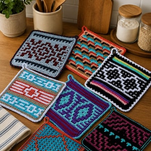 May include: A selection of square crochet potholders with geometric designs in various colours. The potholders feature patterns in shades of blue, red, orange, and black, with white and other accent colours. Each potholder has a hanging loop.