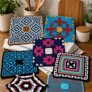 May include: A collection of colorful, crocheted hot pads with geometric and abstract designs. The pads feature various color combinations, including blue, red, and green, and are arranged on a wooden surface. Kitchen decor.