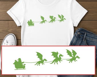 May include: White t-shirt featuring a green graphic of Santa Claus in a sleigh, pulled by three green dragons. The shirt is styled with blue jeans and white trainers.