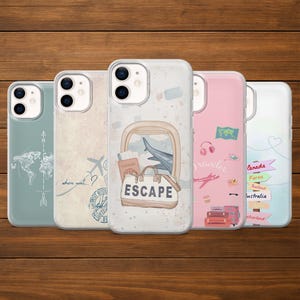 May include: Five phone cases with travel-themed designs. One case features a world map, another has a question mark and airplane, and a third displays a suitcase with the word "ESCAPE". The other two cases have travel-related graphics.