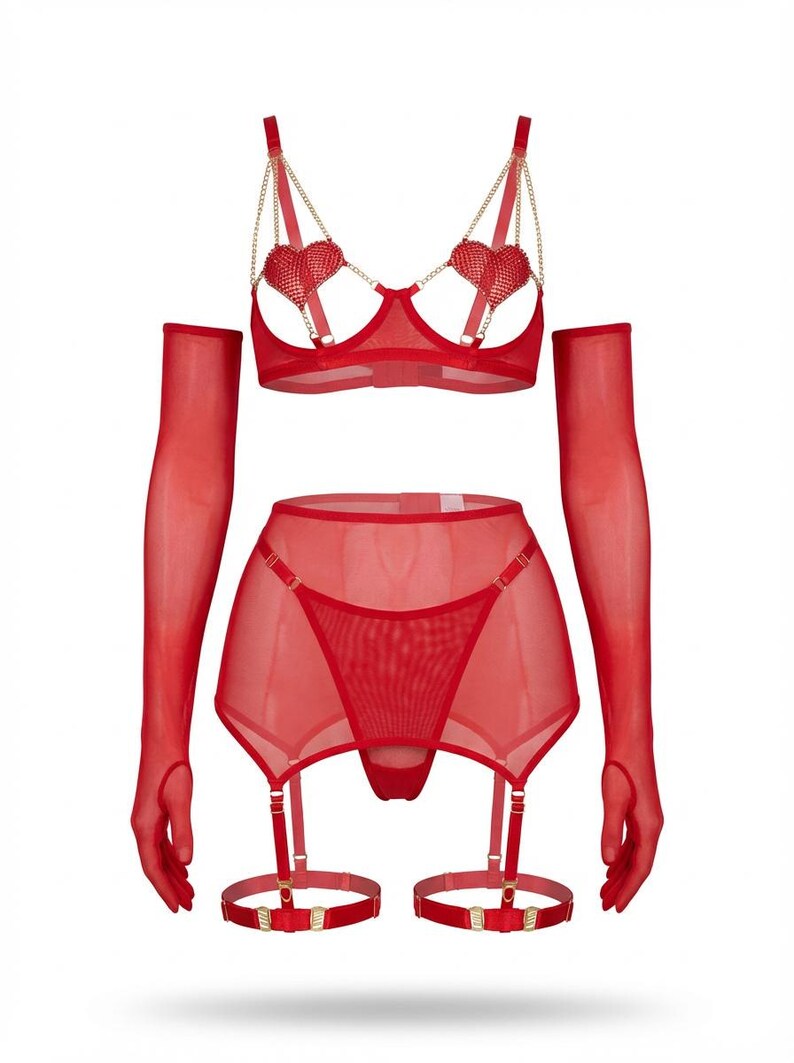 May include: A red lingerie set featuring a bra with heart-shaped embellishments and gold chain straps, a garter skirt, and matching gloves. The set is made of sheer fabric and includes garter straps and garters.