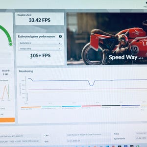 May include: A computer screen displaying a 3DMark benchmark test. The screen shows a score of 3342, graphics test results, and estimated game performance. A red motorcycle graphic with the word "LEGION" is also visible.