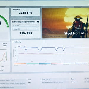 May include: A computer screen displays a 3DMark benchmark test. The "Steel Nomad Score" is 2968, with a graphics test showing 29.68 FPS. The estimated game performance is 120+ FPS. The screen also shows monitoring graphs and system information.