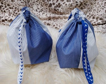 White / blue drawstring small bag. Different variants with different color string. Polyester material.