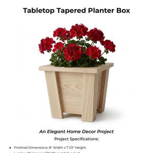 May include: Digital woodworking plans for a tabletop tapered planter box. The planter box is made of light-coloured wood and holds vibrant red flowers. The text reads "An Elegant Home Decor Project". Finished dimensions are 20.3cm width x 19.1cm height.